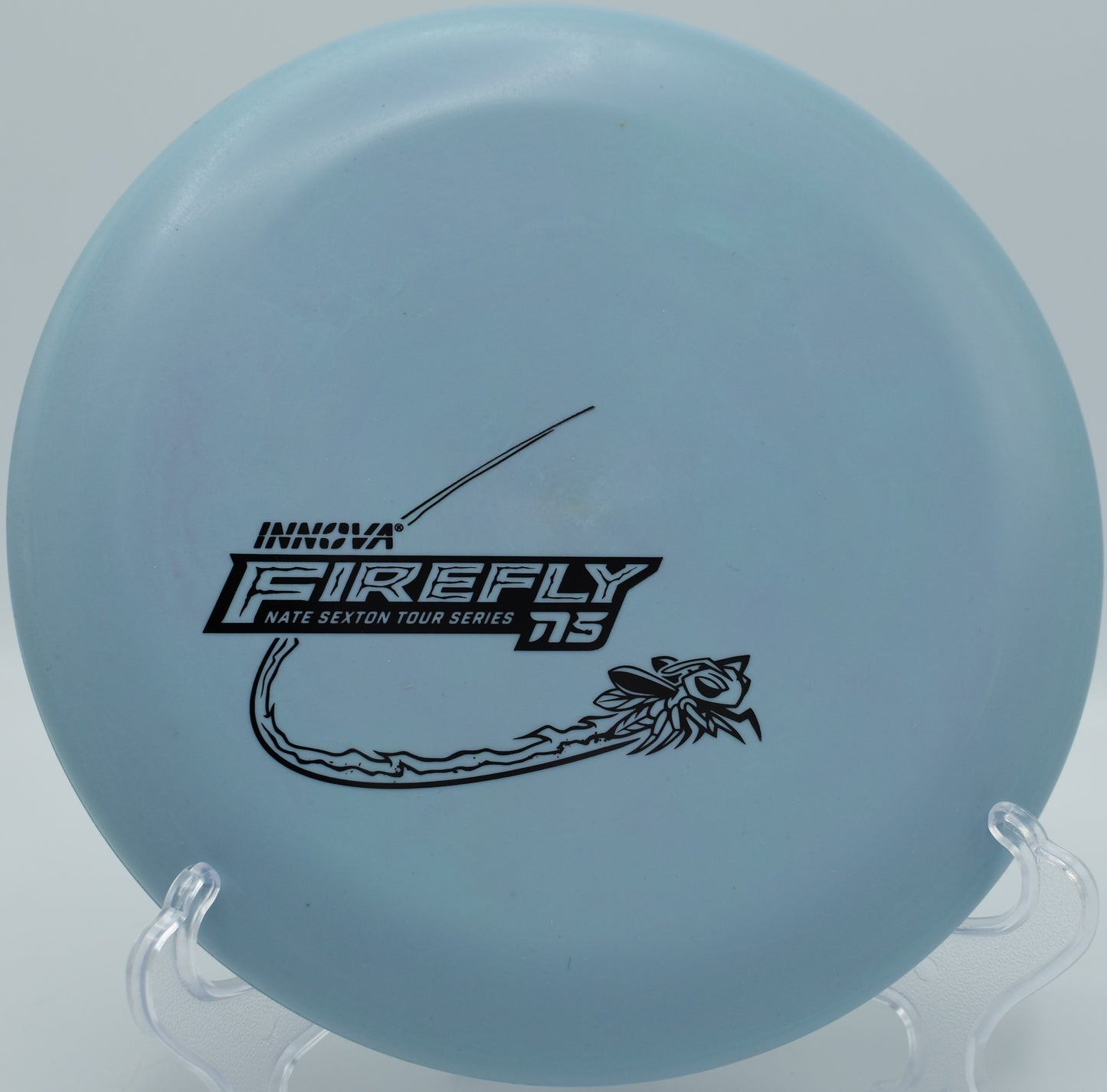 Nexus Firefly shown mid-spin putt from circle edge at Shoaff Park in Fort Wayne, Indiana

