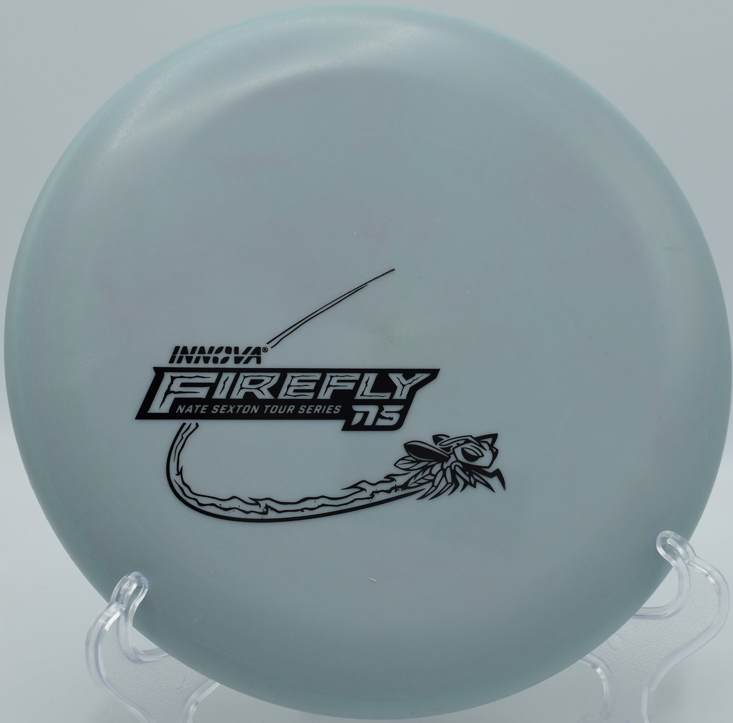 Nexus Firefly disc golf putter displayed on tee pad at Tyler State Park disc golf course in Newtown, Pennsylvania

