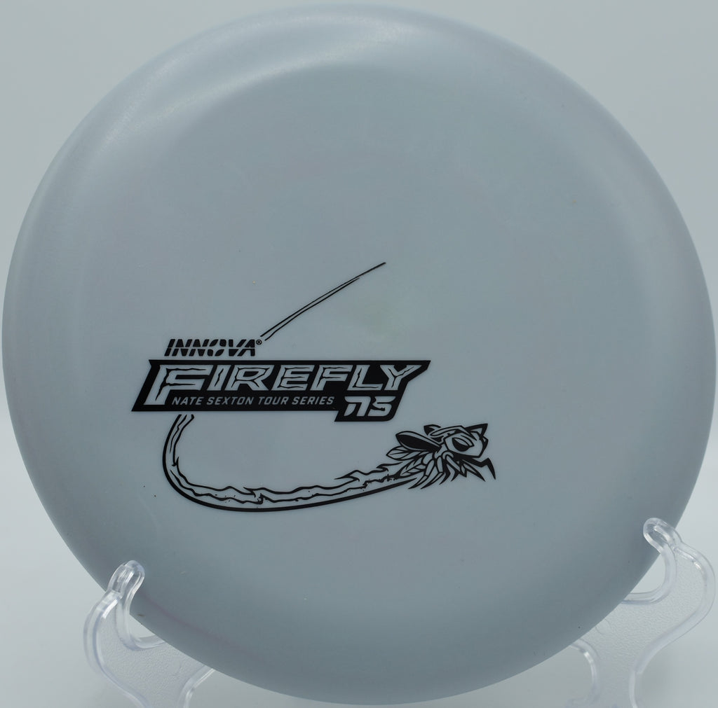 Close-up of Nexus Firefly textured grip plastic before putting at Walnut Ridge disc golf course in Iowa

