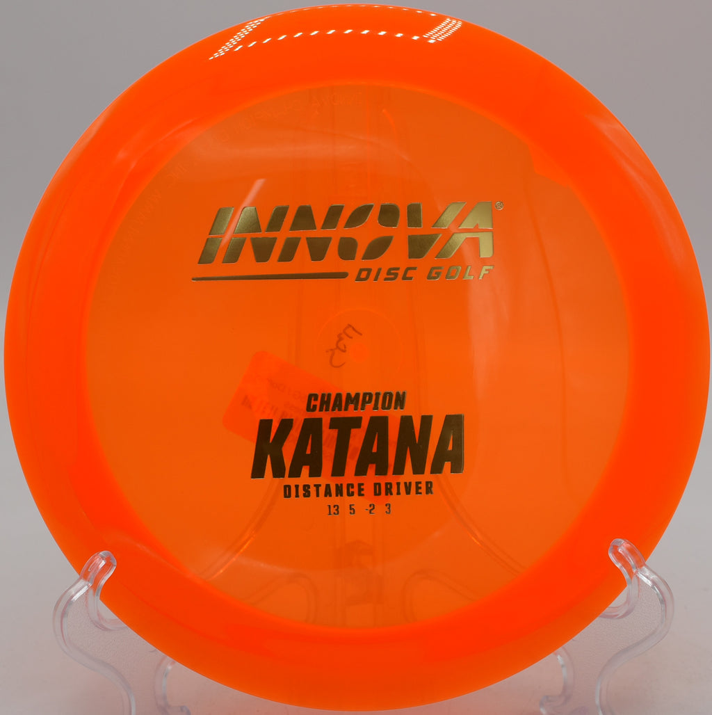 Blizzard Katana floating over an open field drive at Rollin Ridge Disc Golf Course in Reedsville, Wisconsin