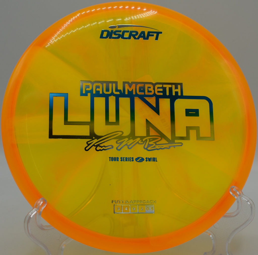 Paul McBeth Luna disc landing softly near the chains at Brandywine Creek Disc Golf Course in Wilmington, Delaware

