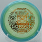 Proto Glow Halo Champion Gorgon flipping up to flat and maximizing glide on Hole 6 at Kincaid Park Disc Golf Course, Anchorage, Alaska.
