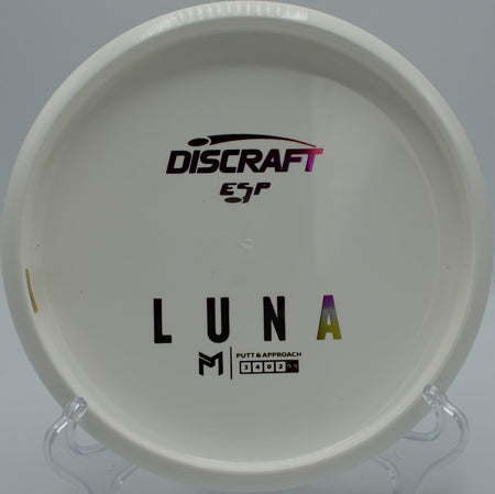 ESP Luna disc golf putter gliding through a wooded gap at Quaker Hill Disc Golf Course, Richmond, Indiana