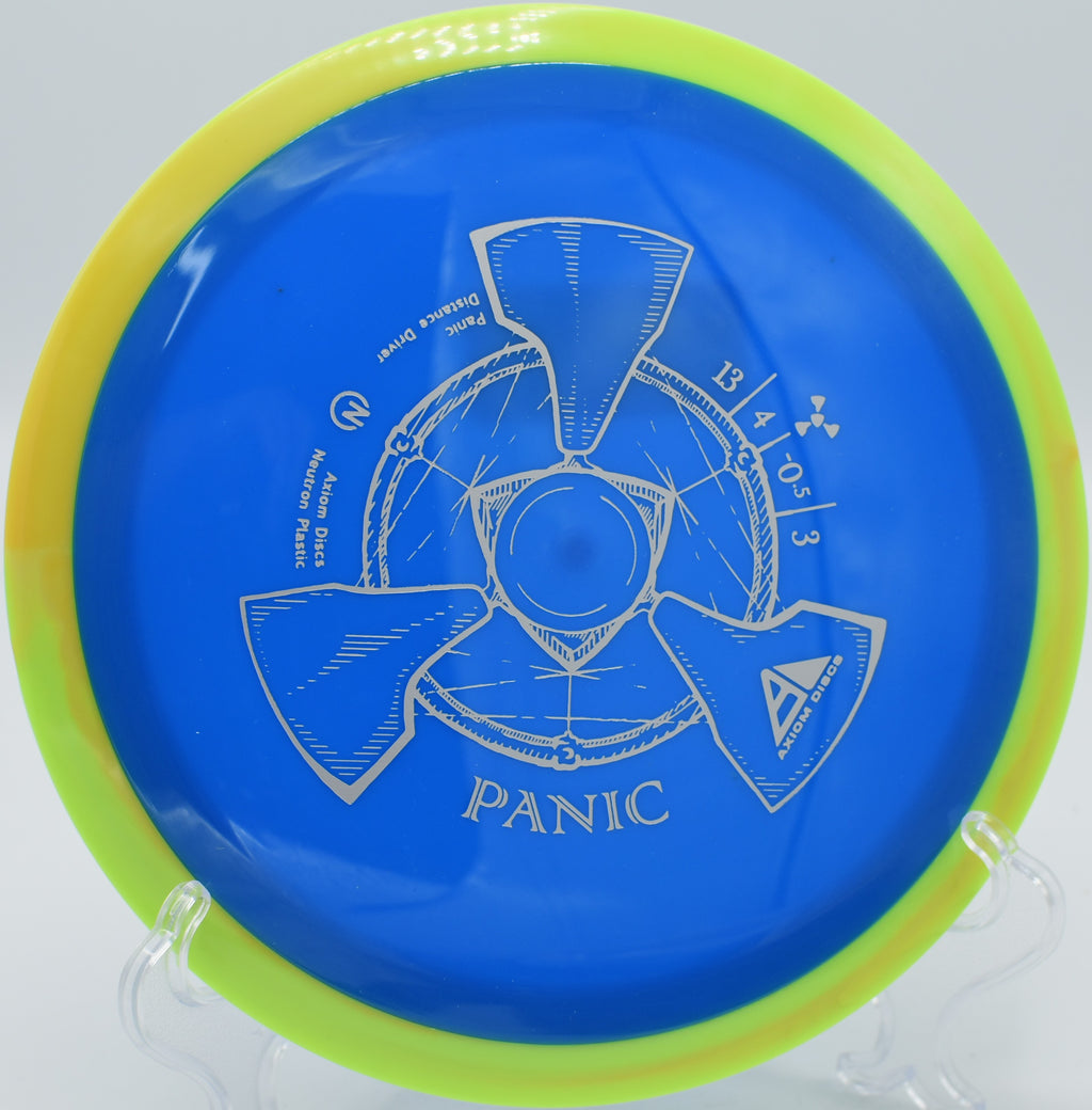 An Axiom Neutron Panic flying over an open fairway at Brackett’s Bluff Disc Golf Course in Davidson, North Carolina.