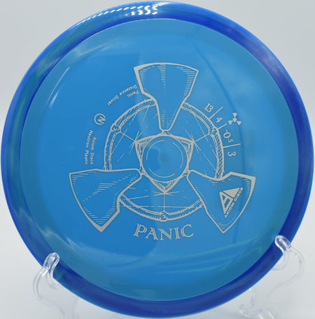 A player ripping a powerful backhand drive with a Neutron Panic at Rollin Ridge Disc Golf Course in Reedsville, Wisconsin.