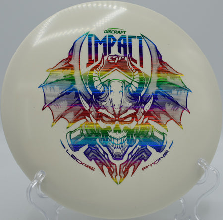 Discraft ESP Glo Impact mid-flight with UV glow at Maple Hill Disc Golf Course in Leicester, Massachusetts

