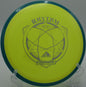 A player using a Fission Rhythm for a finesse turnover drive at Timber Ridge Disc Golf Course in Castile, New York.