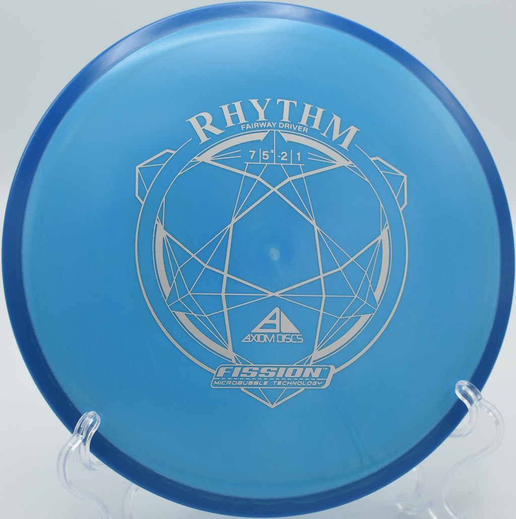 A player executing a controlled anhyzer drive with a Fission Rhythm at Kensington Toboggan Disc Golf Course in Milford, Michigan.