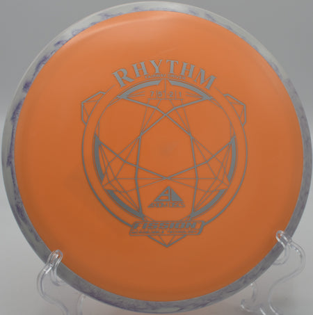 An Axiom Fission Rhythm floating through a technical wooded fairway at Tyler State Park Disc Golf Course in Newtown, Pennsylvania.