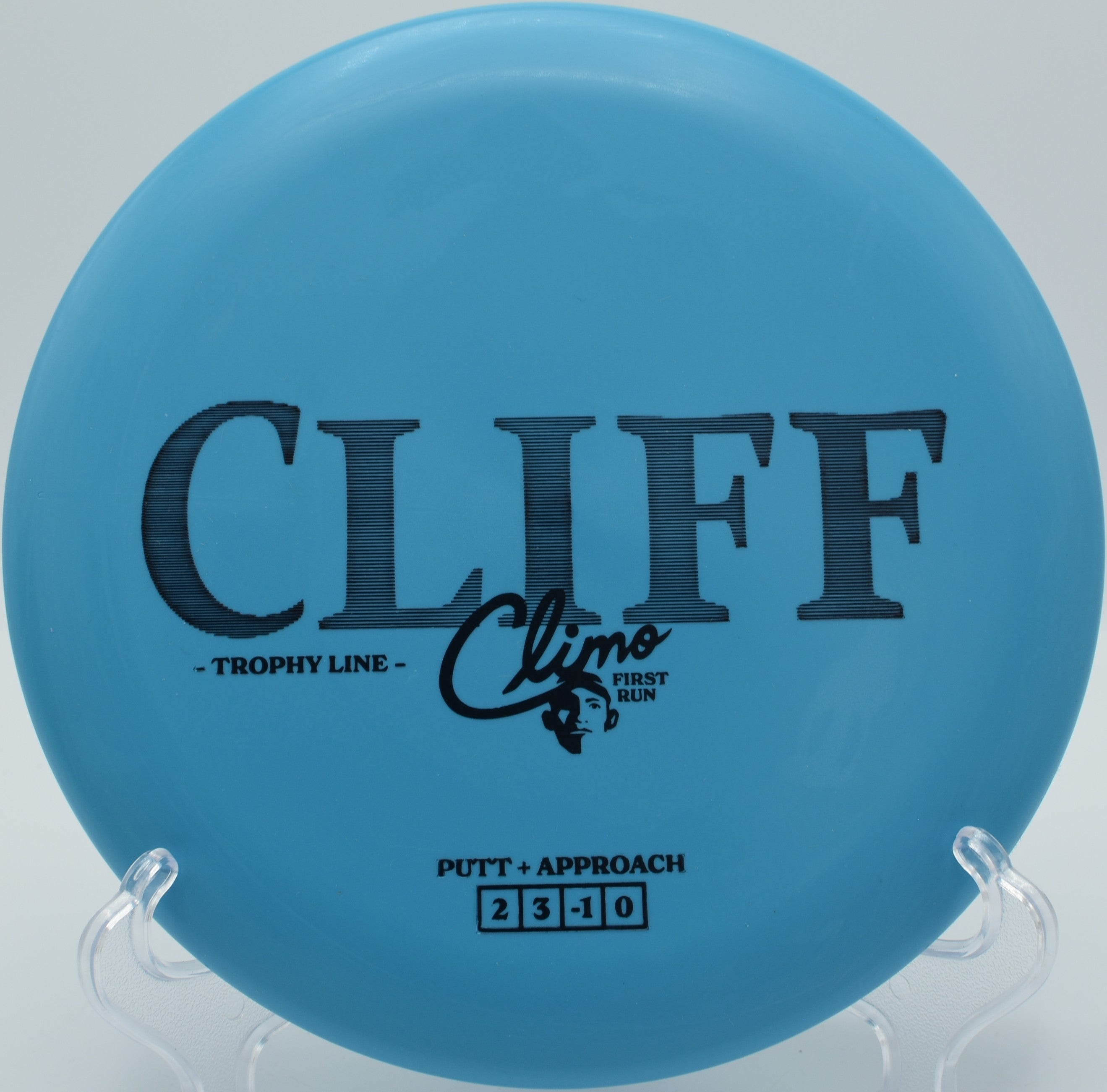 Trophy Line Cliff disc golf putter gliding through mature trees at Bandemer Park Disc Golf Course, Ann Arbor, Michigan