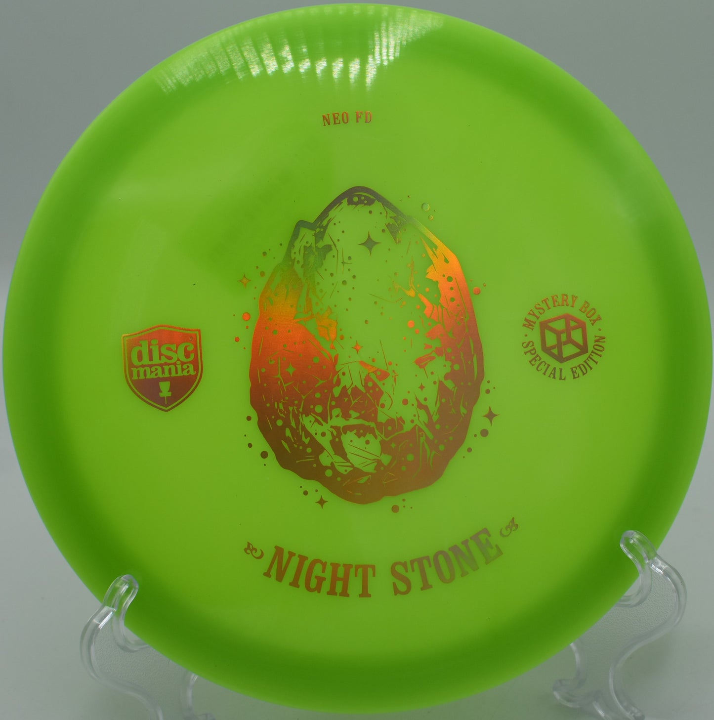 "Night Stone Neo Essence disc golf driver with a sleek design, captured mid-flight at The Blockhouse Disc Golf Course in Spotsylvania, VA."
