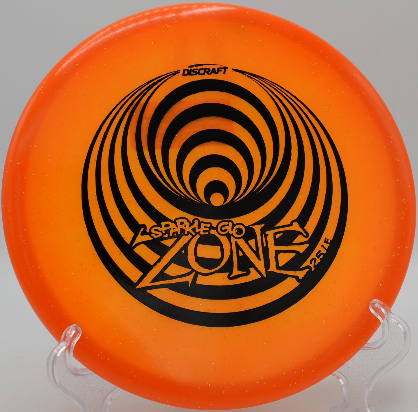 Discraft Z Sparkle Glo Zone glowing over open field at The Canyons in Lockport, Illinois

