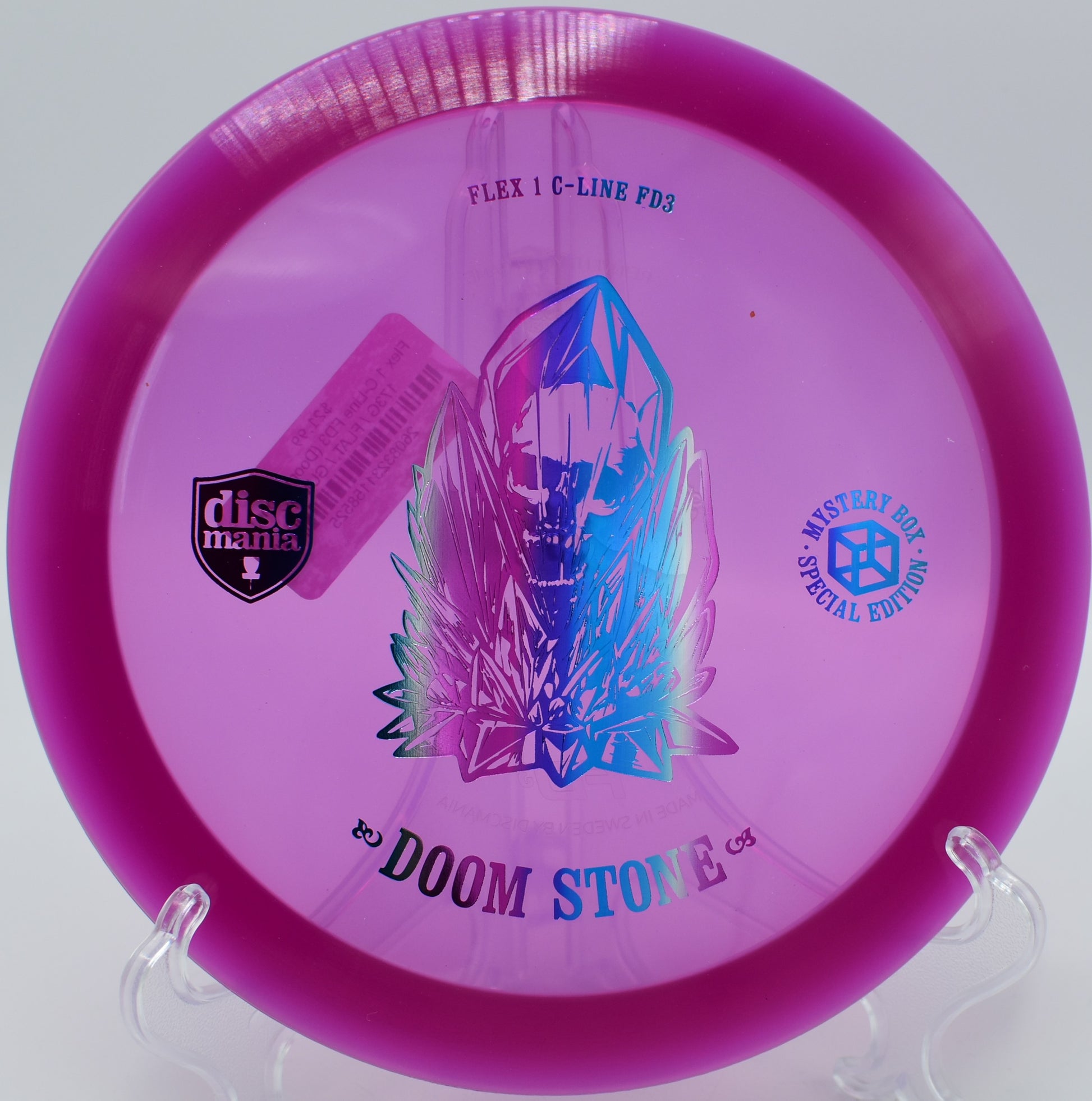 "Doom Stone disc captured mid-flight at Milo McIver Disc Golf Course in Estacada, Oregon, showcasing its dependable fade and stability."
