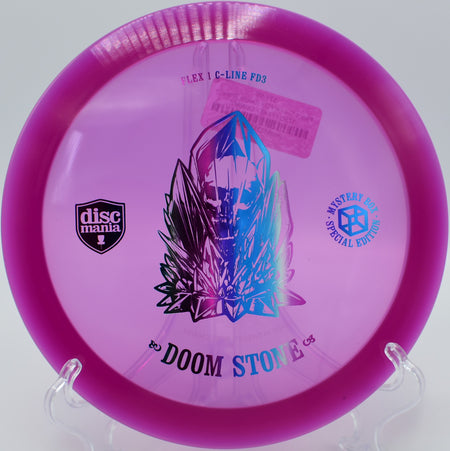 "Doom Stone disc cutting through a windy fairway at Toboggan Disc Golf Course in Milford, Michigan, demonstrating its overstable performance."
