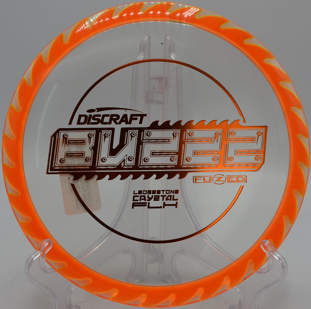 FuZed Buzzz specialty run gliding toward the basket at Blue Ribbon Pines in East Bethel, Minnesota