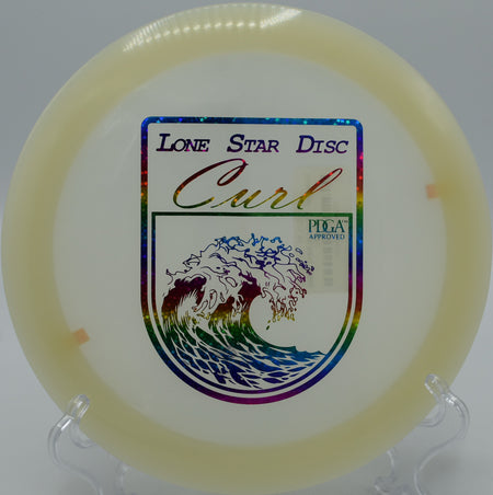 "Lone Star Curl distance driver captured mid-flight at Shelton Springs Disc Golf Course in Shelton, Washington, perfect for long, controlled throws."
