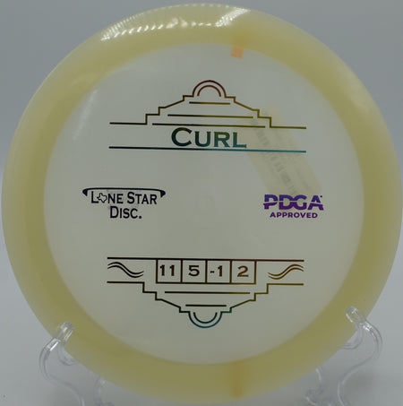 "Lone Star Curl disc gliding through wooded paths at White River Disc Golf Course in Auburn, Washington, showcasing its accuracy and glide."
