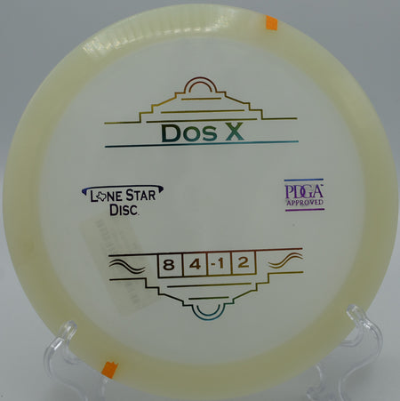 "Lone Star Dos X disc resting near the basket at Riverside Disc Golf Course in Sumner, Washington, ready for a clean putt."
