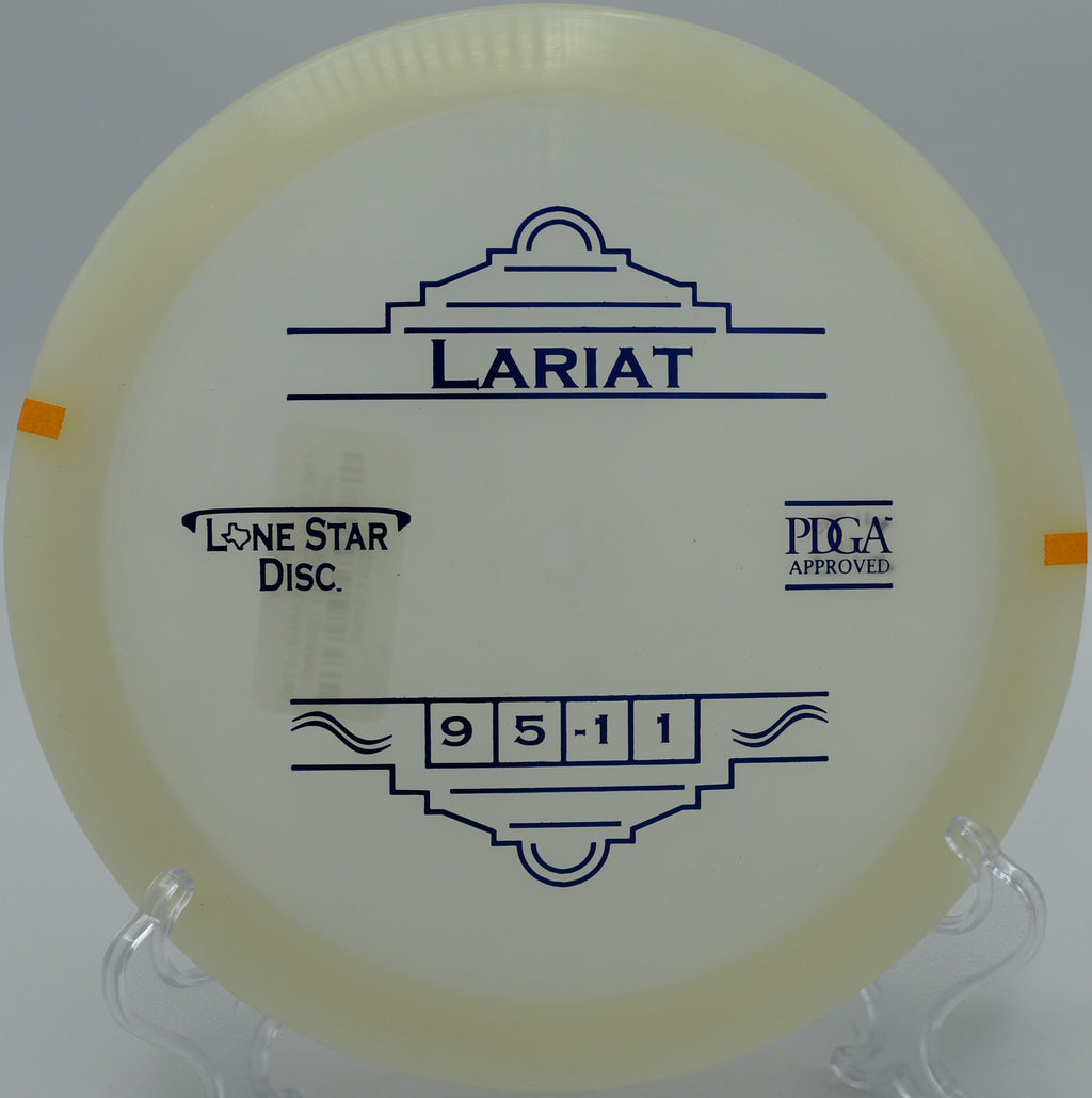 "Lone Star Glow Lariat disc glowing under the trees at Tom Pearce Park Disc Golf Course in Grants Pass, Oregon, highlighting its stability."
