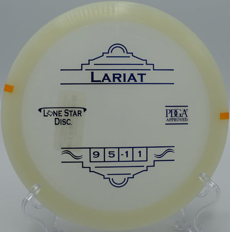 "Lone Star Glow Lariat disc glowing under the trees at Tom Pearce Park Disc Golf Course in Grants Pass, Oregon, highlighting its stability."
