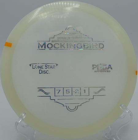 "Lone Star Glow Mockingbird flying true through wooded paths at Iron Hill Disc Golf Course in Newark, Delaware, with exceptional glide."
