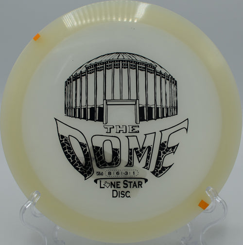 "Glow The Dome disc glowing brightly under the night sky in Los Angeles, California, perfect for smooth, controlled throws."
