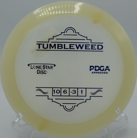 "Close-up of the Glow Tumbleweed disc spinning perfectly off the tee in Boulder, Colorado, engineered for maximum glide and control."
