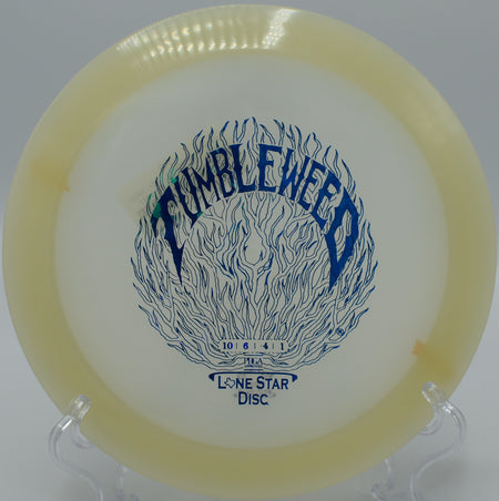 "Glow Tumbleweed disc landing softly near the basket in Albuquerque, New Mexico, perfect for approach shots and accuracy."
