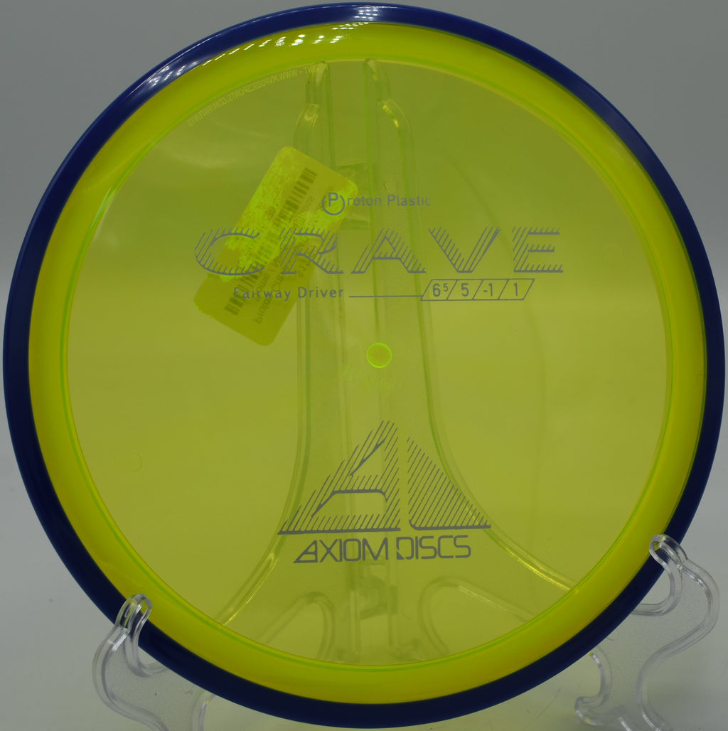 Proton Crave held up against a mountain backdrop at Base Camp Adventure Disc Golf Course in Moab, Utah