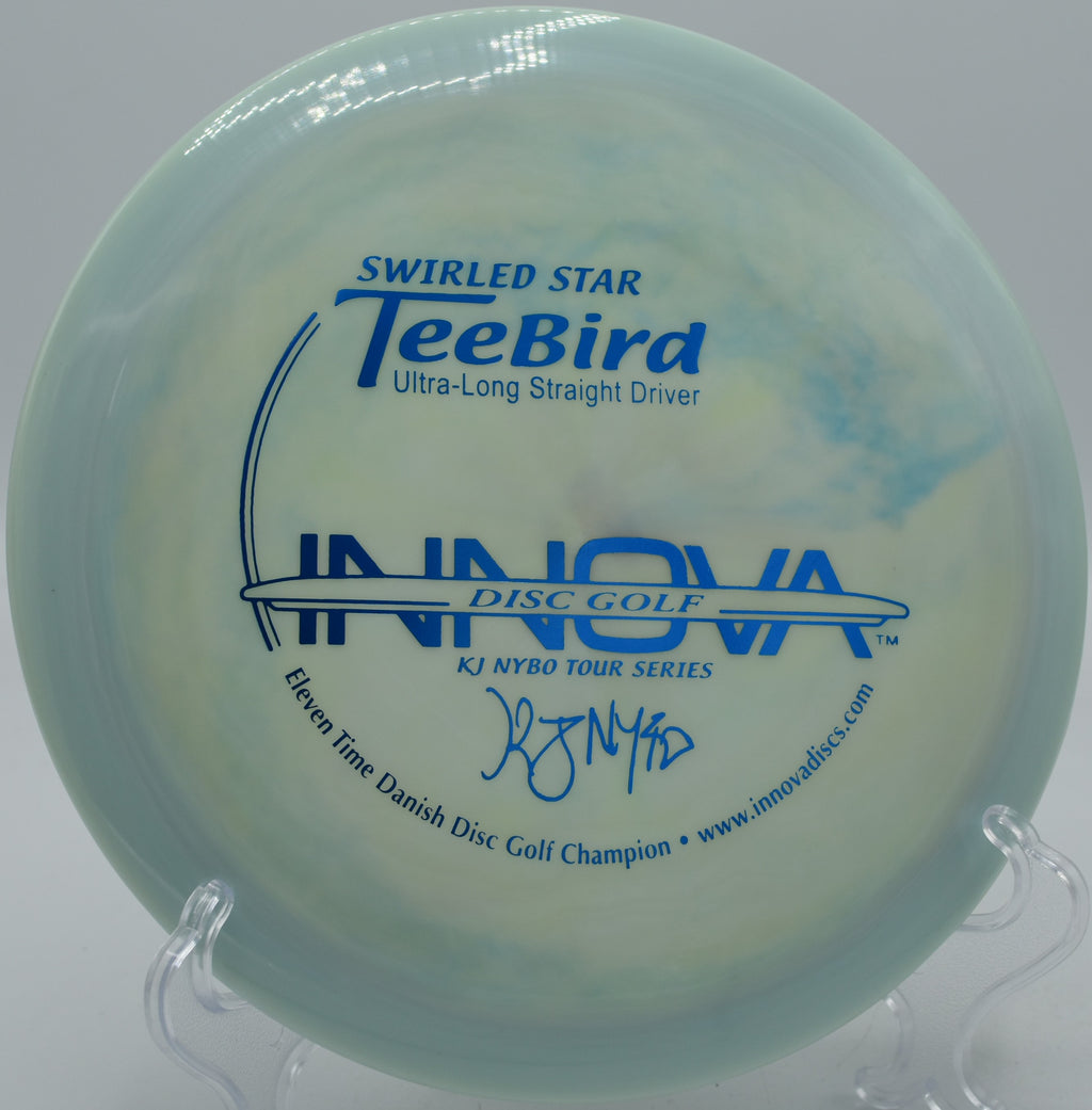 Swirled Star TeeBird gliding toward the basket at Reservoir Park Disc Golf Course in Southern Pines, North Carolina.