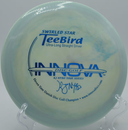 Swirled Star TeeBird gliding toward the basket at Reservoir Park Disc Golf Course in Southern Pines, North Carolina.