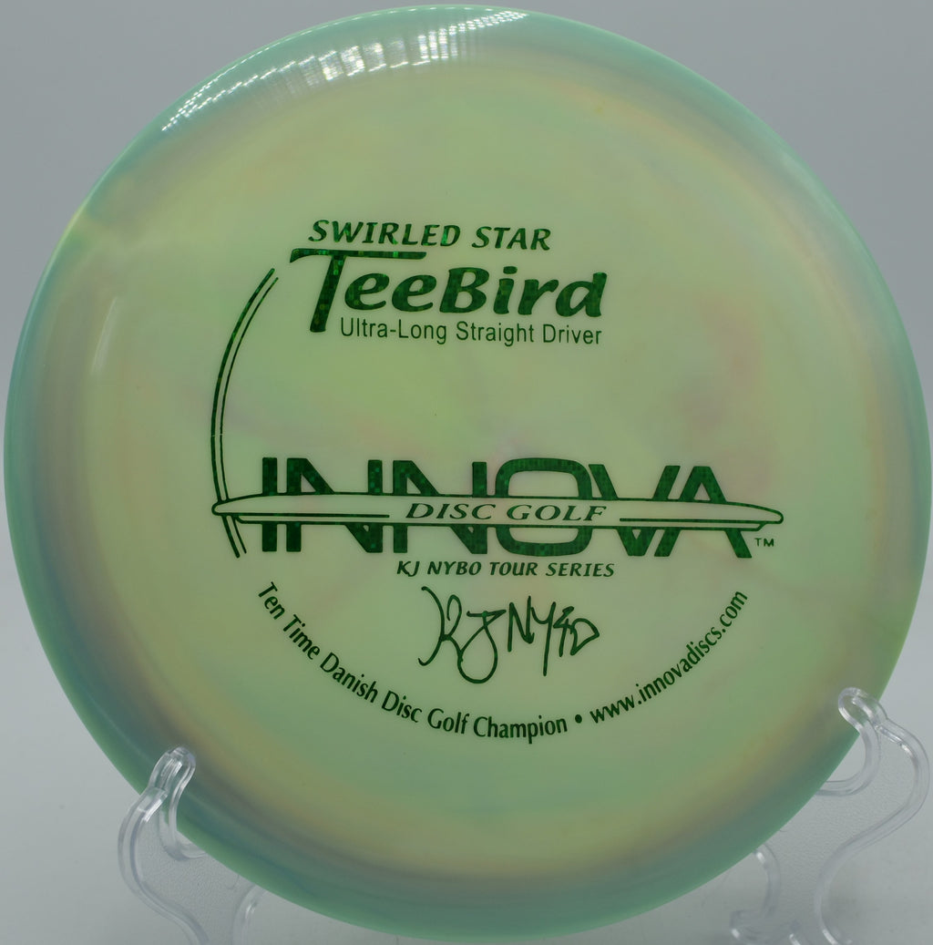 Flexing a Swirled Star TeeBird around trees at Wildcat Bluff Disc Golf Course in Urbana, Iowa.