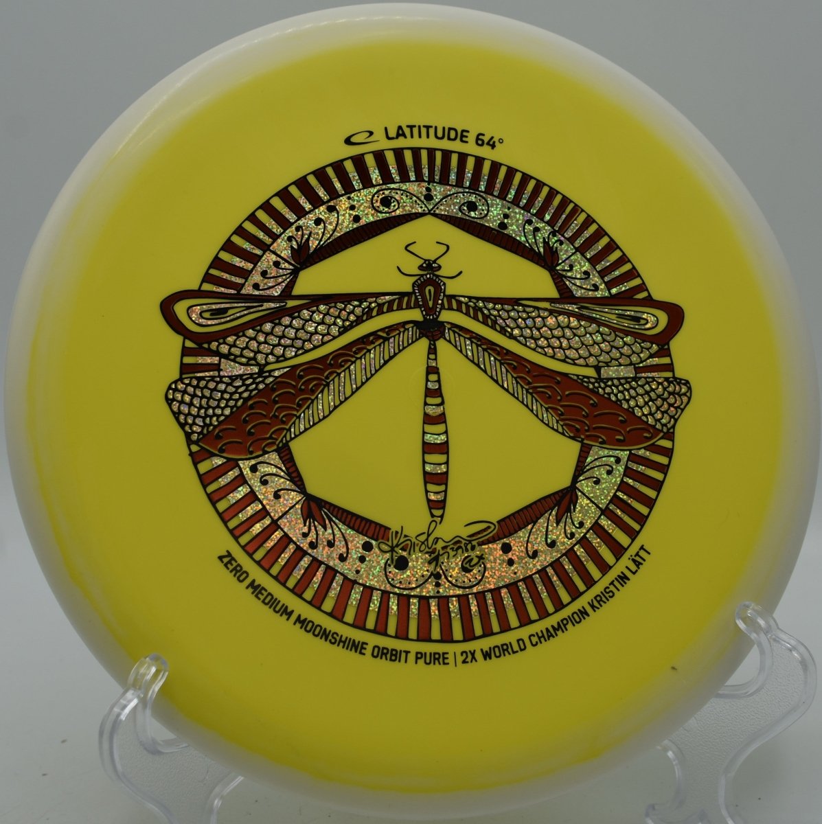 Latitude 64 Zero Medium Pure glowing disc sitting in circle at Hornets Nest Disc Golf Course in Charlotte, North Carolina