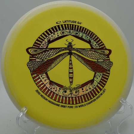Latitude 64 Zero Medium Pure glowing disc sitting in circle at Hornets Nest Disc Golf Course in Charlotte, North Carolina
