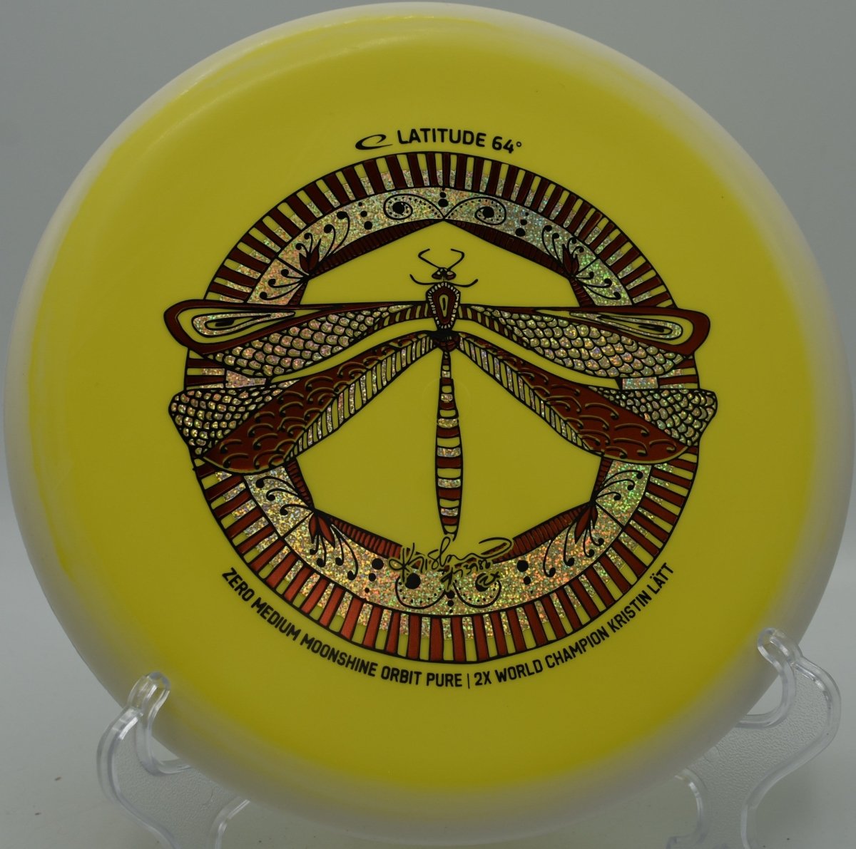 Zero Medium Moonshine Orbit Pure disc golf putter glowing on hillside green at Toboggan Disc Golf Course in Milford, Michigan