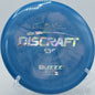Discraft ESP Buzzz flying straight through wooded fairway at Cedar Hill Park in Nashville, Tennessee

