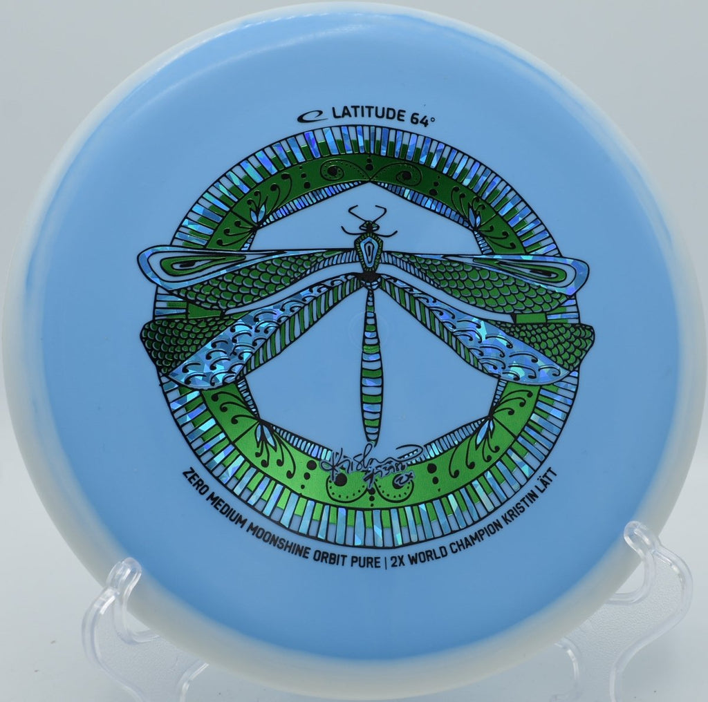 Latitude 64 Pure glow putter sitting near pin at Fox Run Meadows Disc Golf Course in Smugglers Notch, Vermont