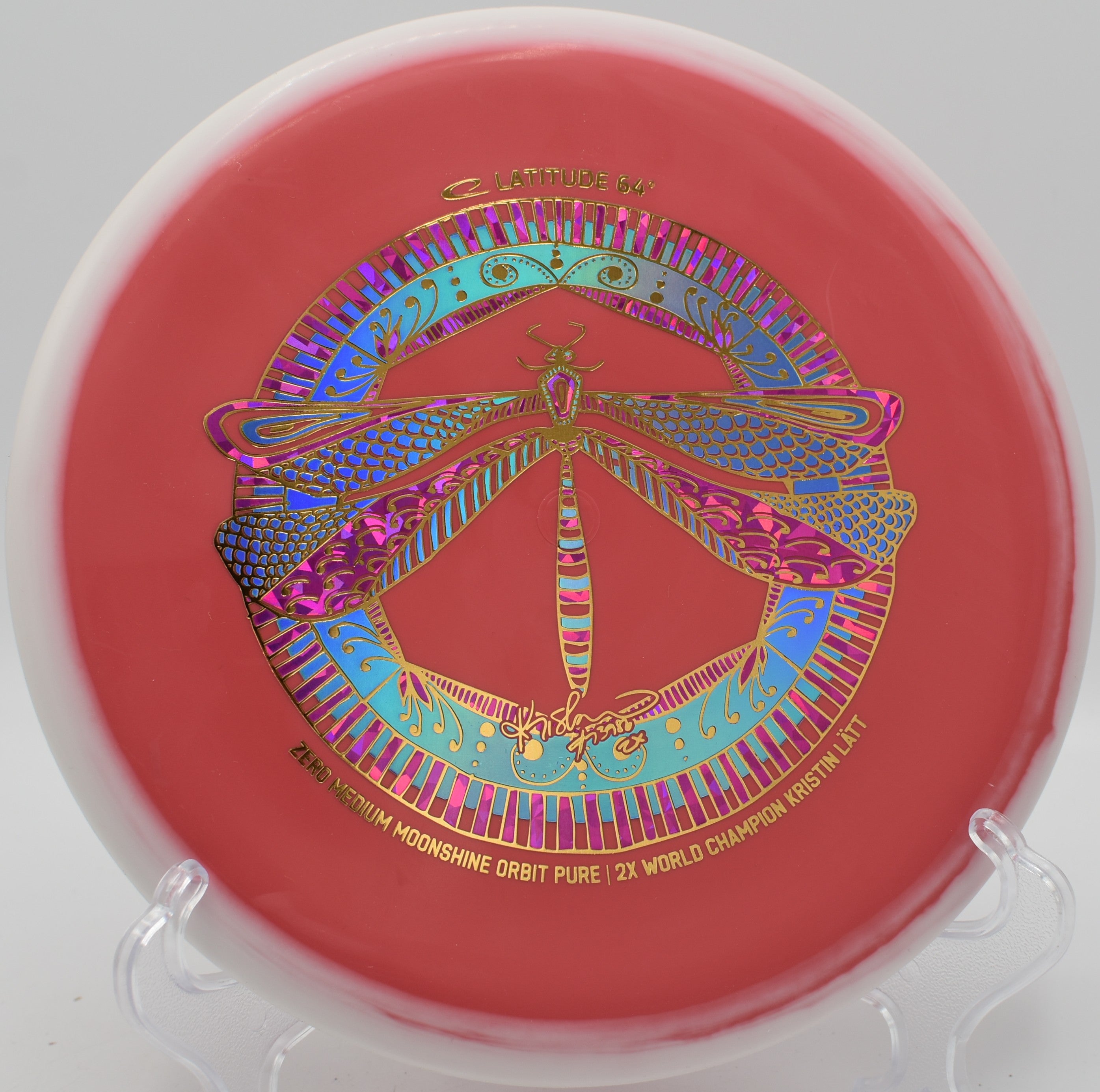 Latitude 64 Orbit Pure glow disc on green at Selah Ranch Disc Golf Course in Talco, Texas championship layout
