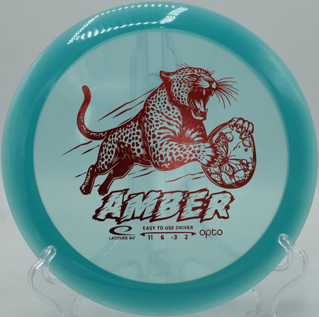 Opto Amber distance driver showcased at Harmony Bends Disc Golf Course in Columbia, Missouri, offering controlled distance and glide