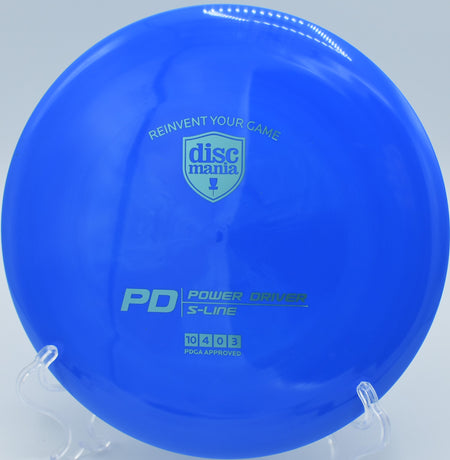 "S-Line PD disc resting on a disc golf basket at DeLaveaga Disc Golf Course in Santa Cruz, CA."
