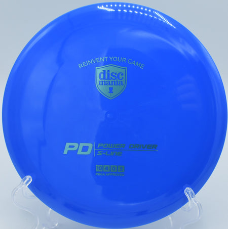 "Close-up of the S-Line PD fairway driver, a top-performing disc, captured at Blue Ribbon Pines Disc Golf Course in East Bethel, MN."
