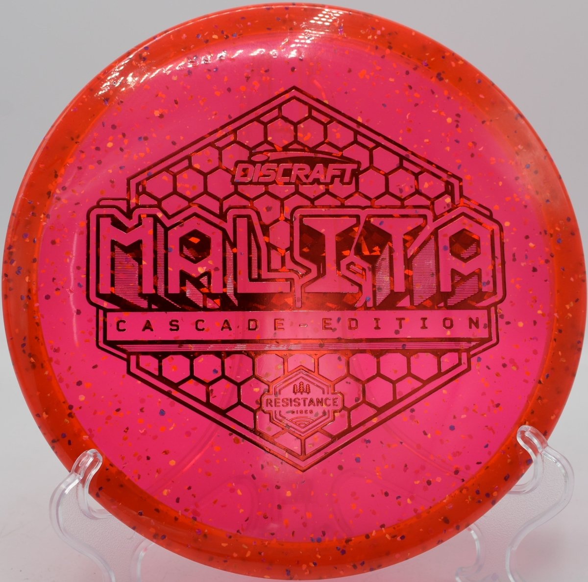 Z Confetti Malita disc golf midrange holding a tunnel shot at Maple Hill Disc Golf Course, Leicester, Massachusetts