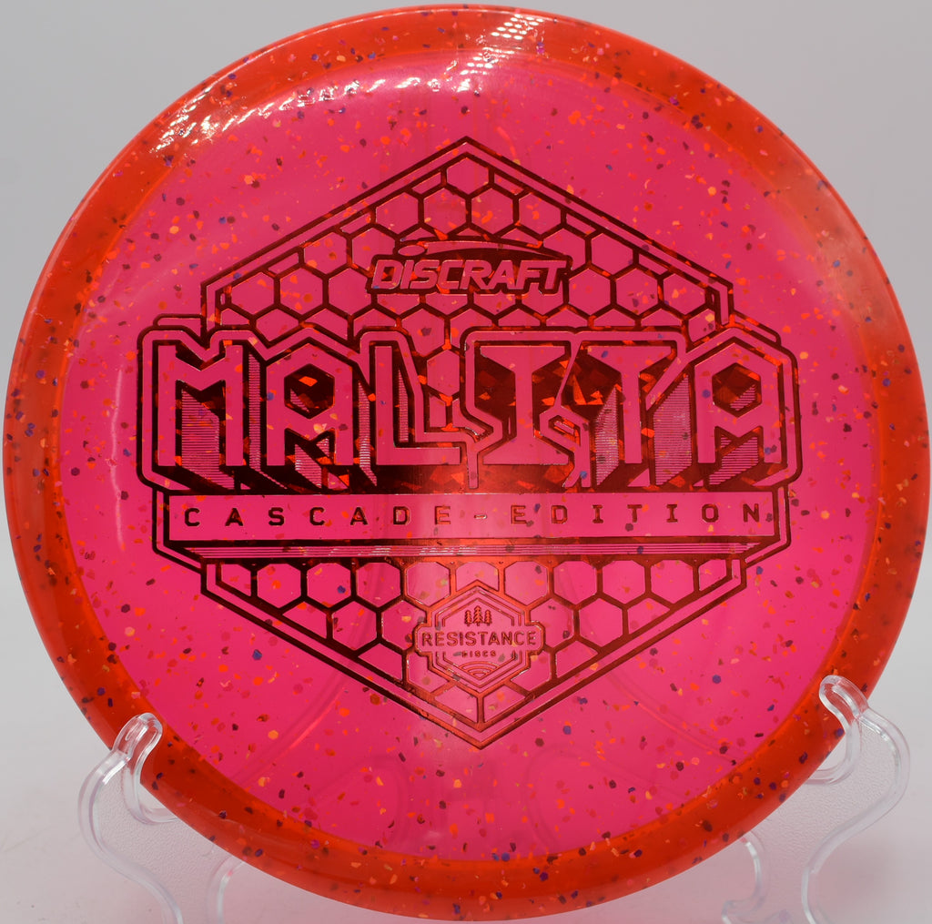 Z Confetti Malita disc golf midrange holding a tunnel shot at Maple Hill Disc Golf Course, Leicester, Massachusetts