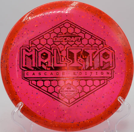 Z Confetti Malita disc golf midrange holding a tunnel shot at Maple Hill Disc Golf Course, Leicester, Massachusetts