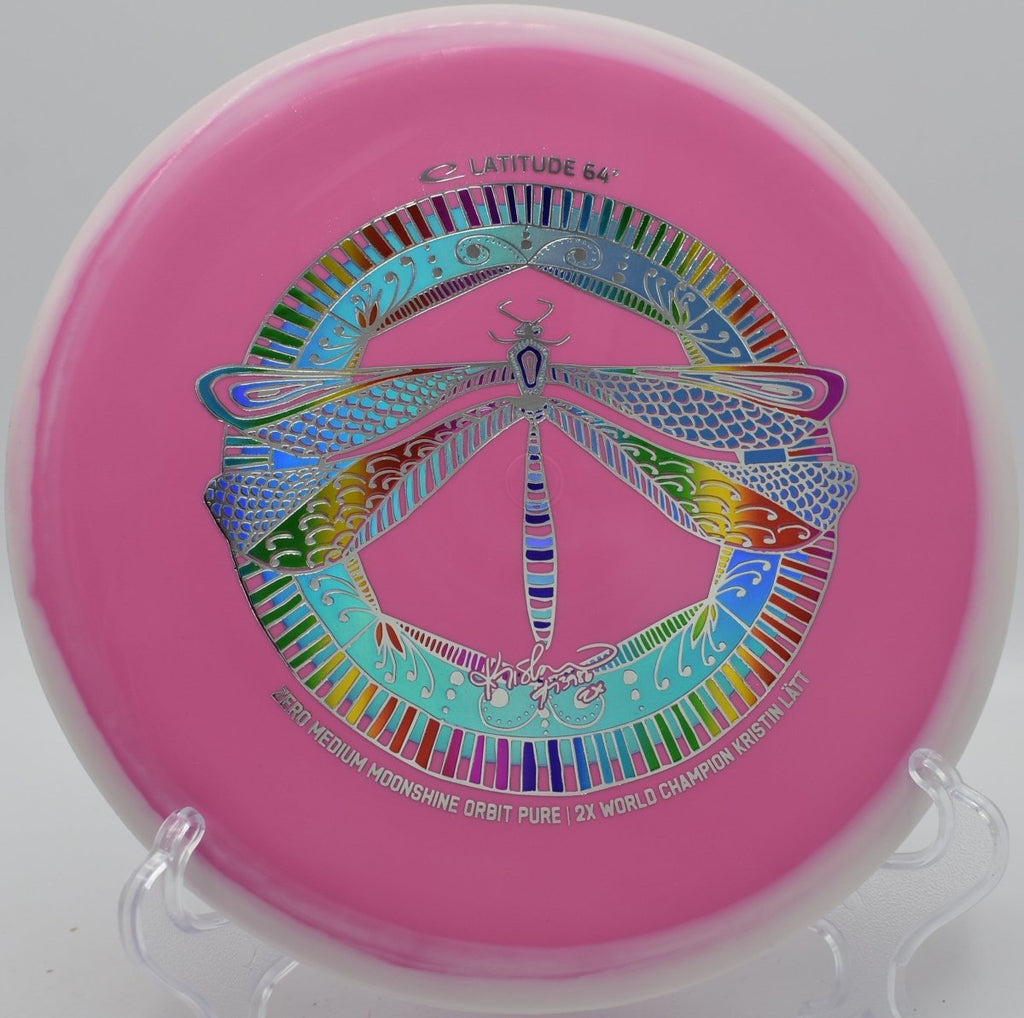 Moonshine Orbit Pure glowing disc golf putter near basket at Zilker Park Disc Golf Course in Austin, Texas