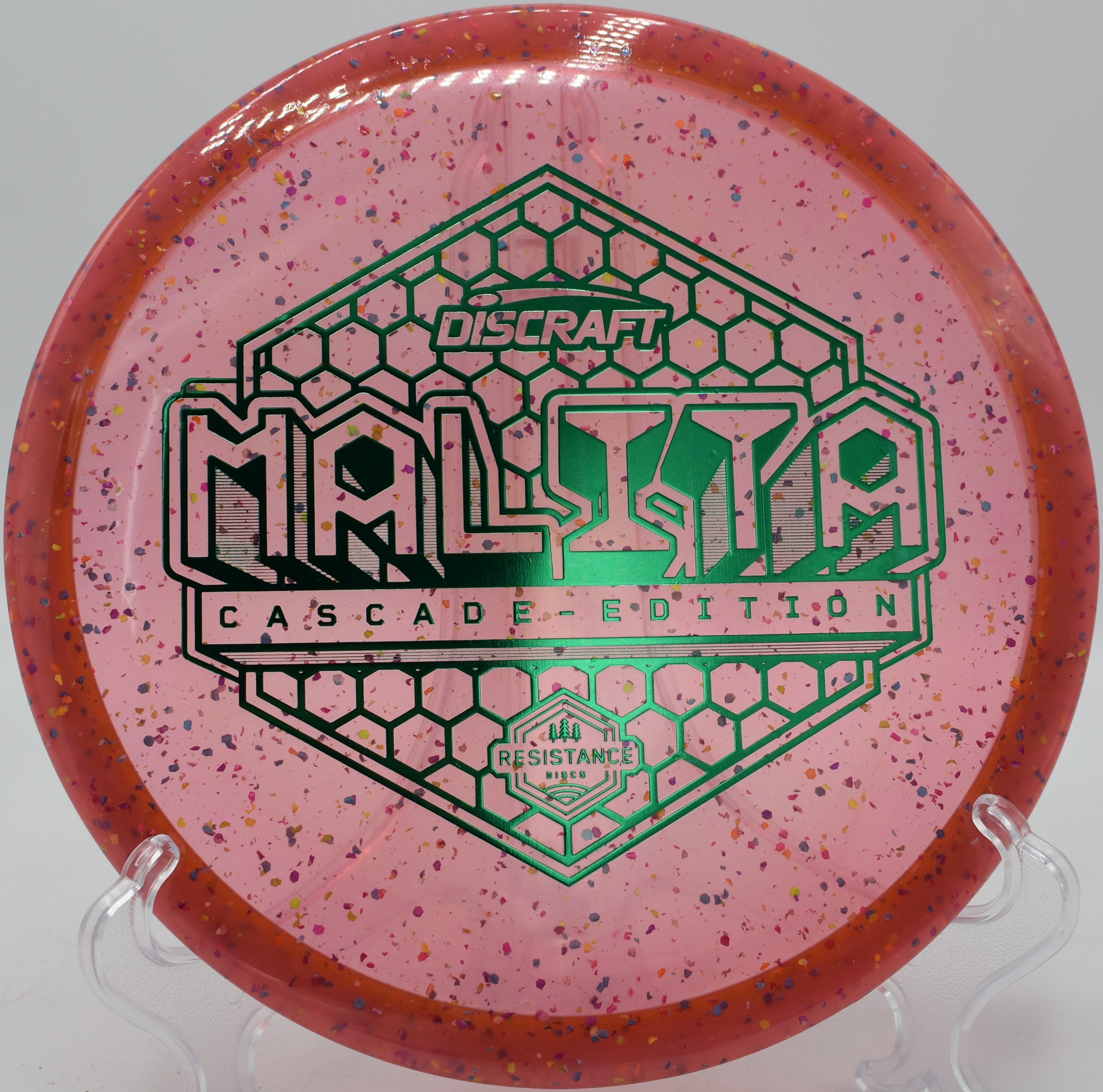 Z Confetti Malita disc golf midrange floating through a wooded gap at Nevin Park Disc Golf Course, Charlotte, North Carolina