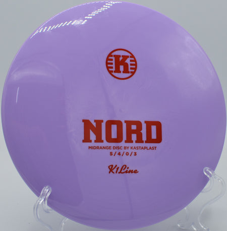 K1 Nord gliding straight through a wooded fairway at Camden II Disc Golf Course in Milan, Illinois.

