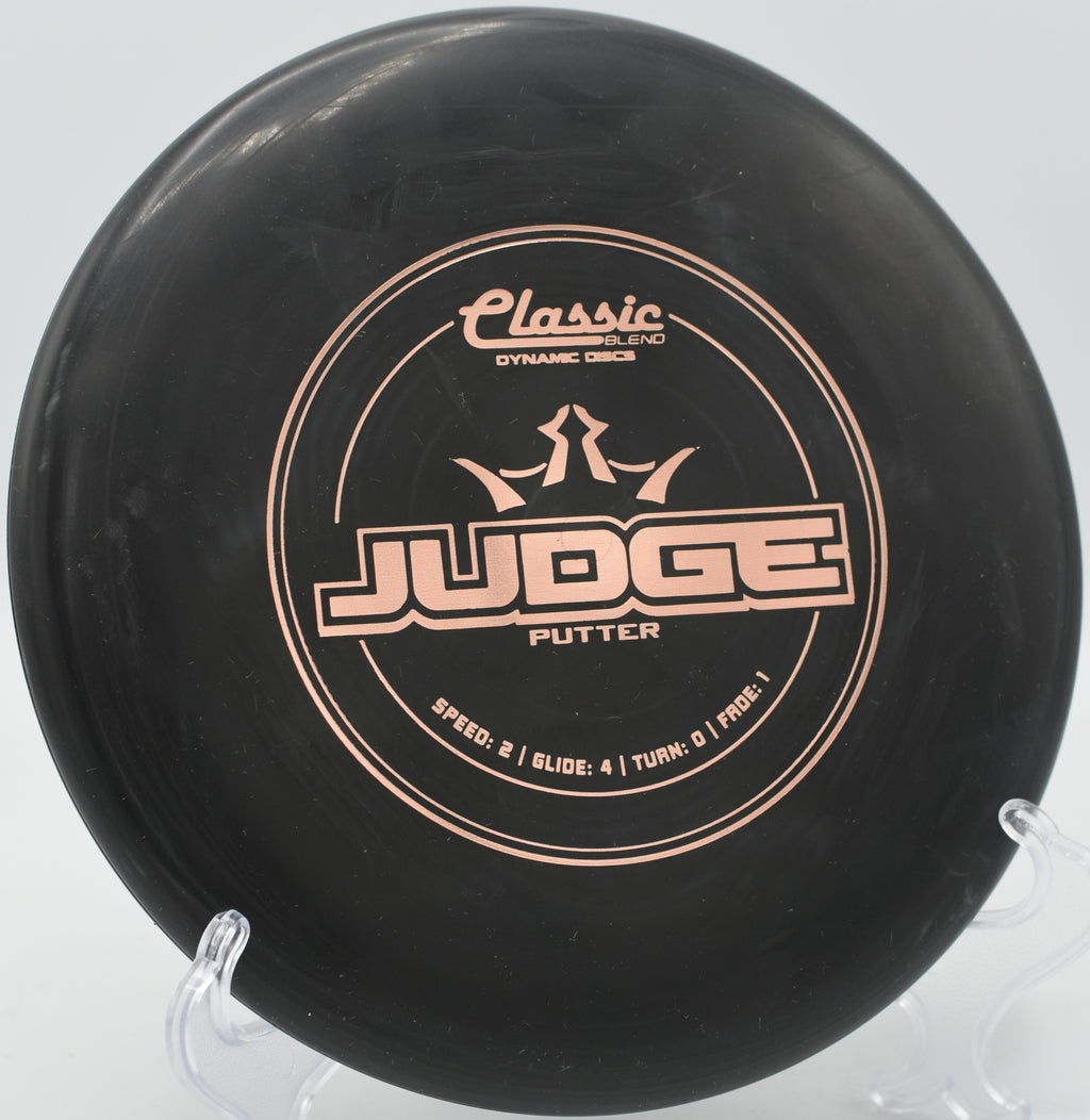 Dynamic Discs Classic Blend Judge resting under the basket at Lincoln Ridge Park in Independence, Kentucky.

