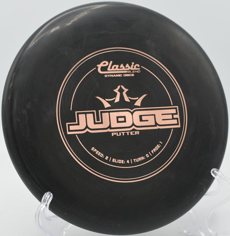 Dynamic Discs Classic Blend Judge resting under the basket at Lincoln Ridge Park in Independence, Kentucky.

