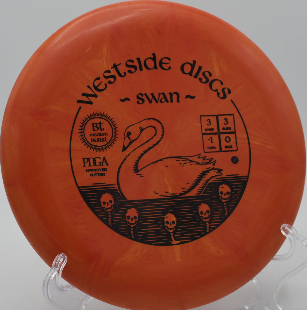Westside Discs BT Burst Medium Swan spinning toward the chains at Sunset Park Disc Golf Course in Las Vegas, Nevada.

